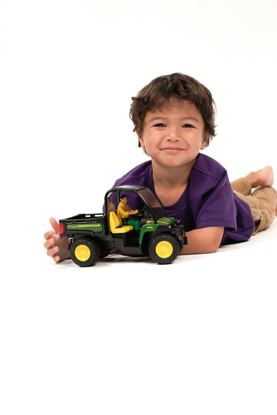 John Deere Gator XUV 855D with driver
